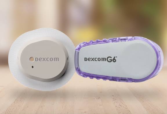 Image showing the Dexcom G7 CGM and Dexcom G6 sitting on a table.